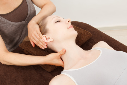 Beautiful young caucasian woman undergoing a massage
